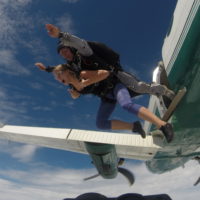 Tandem student and instructor jump from a plane