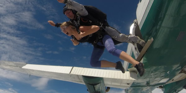 Tandem student and instructor jump from a plane