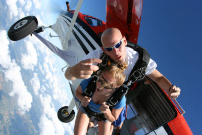 Tandem skydivers after jumping out of the plane