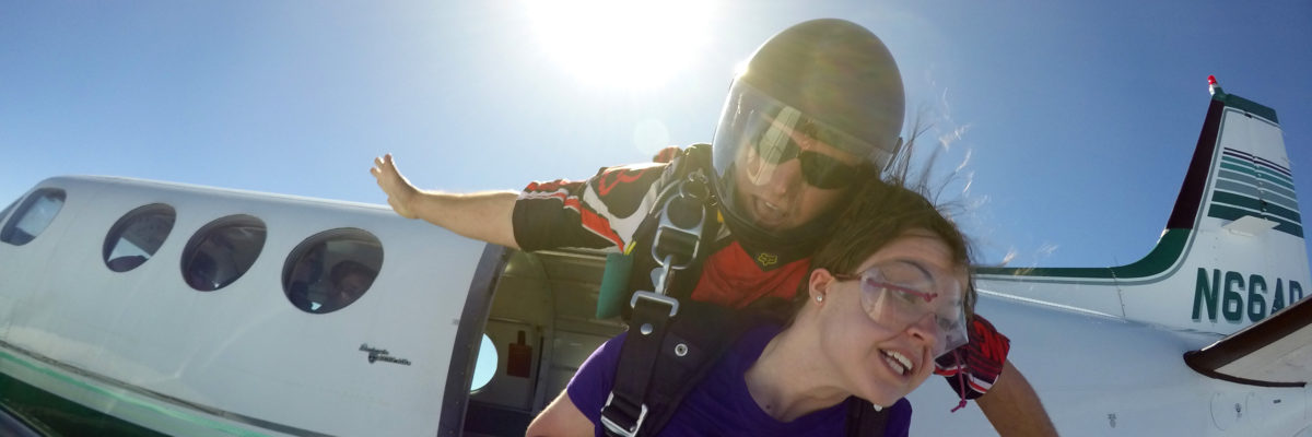 Tandem skydivers jumping from a plane