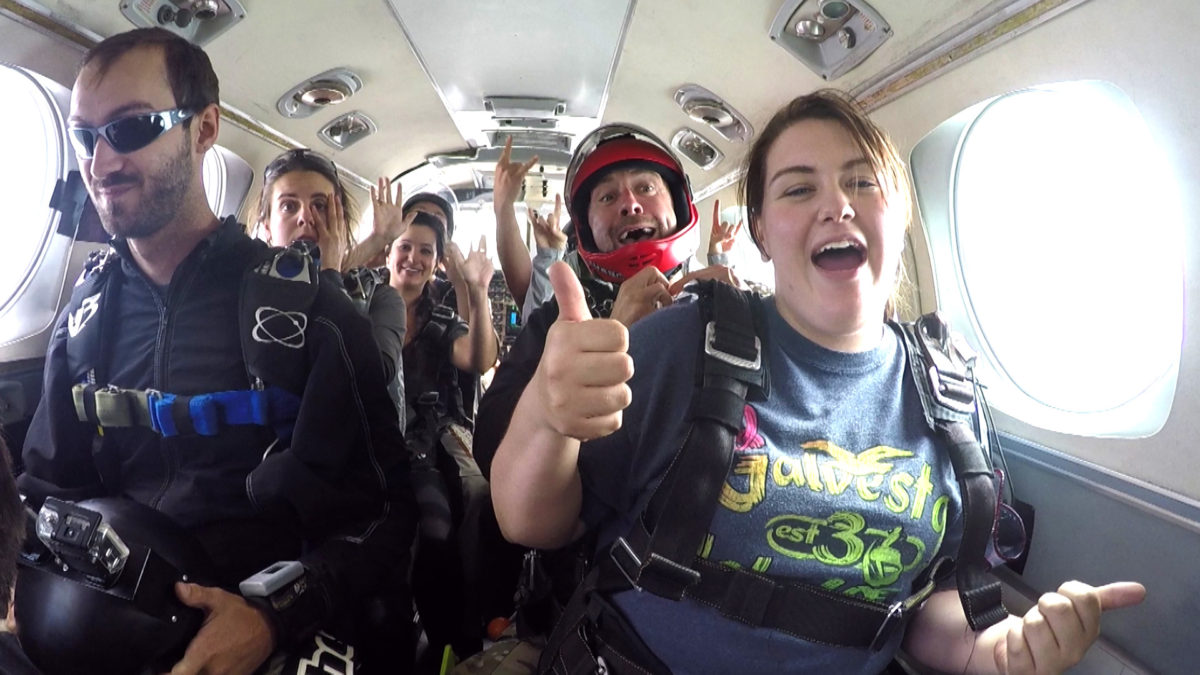 Skydivers in the plane before their jump