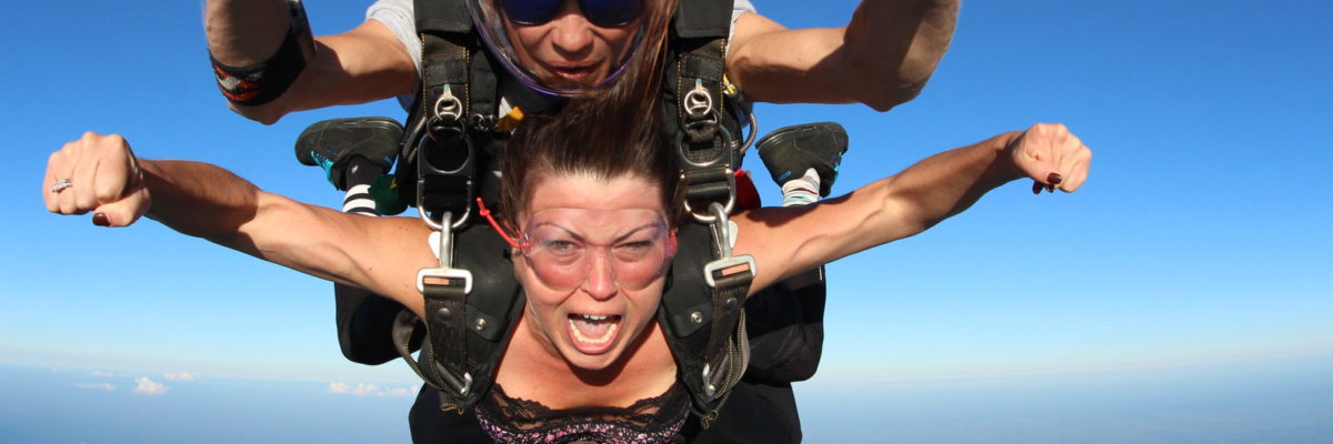 A tandem student shouts while in free fall