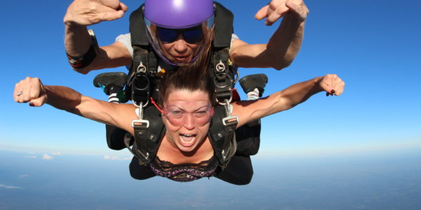 A tandem student shouts while in free fall